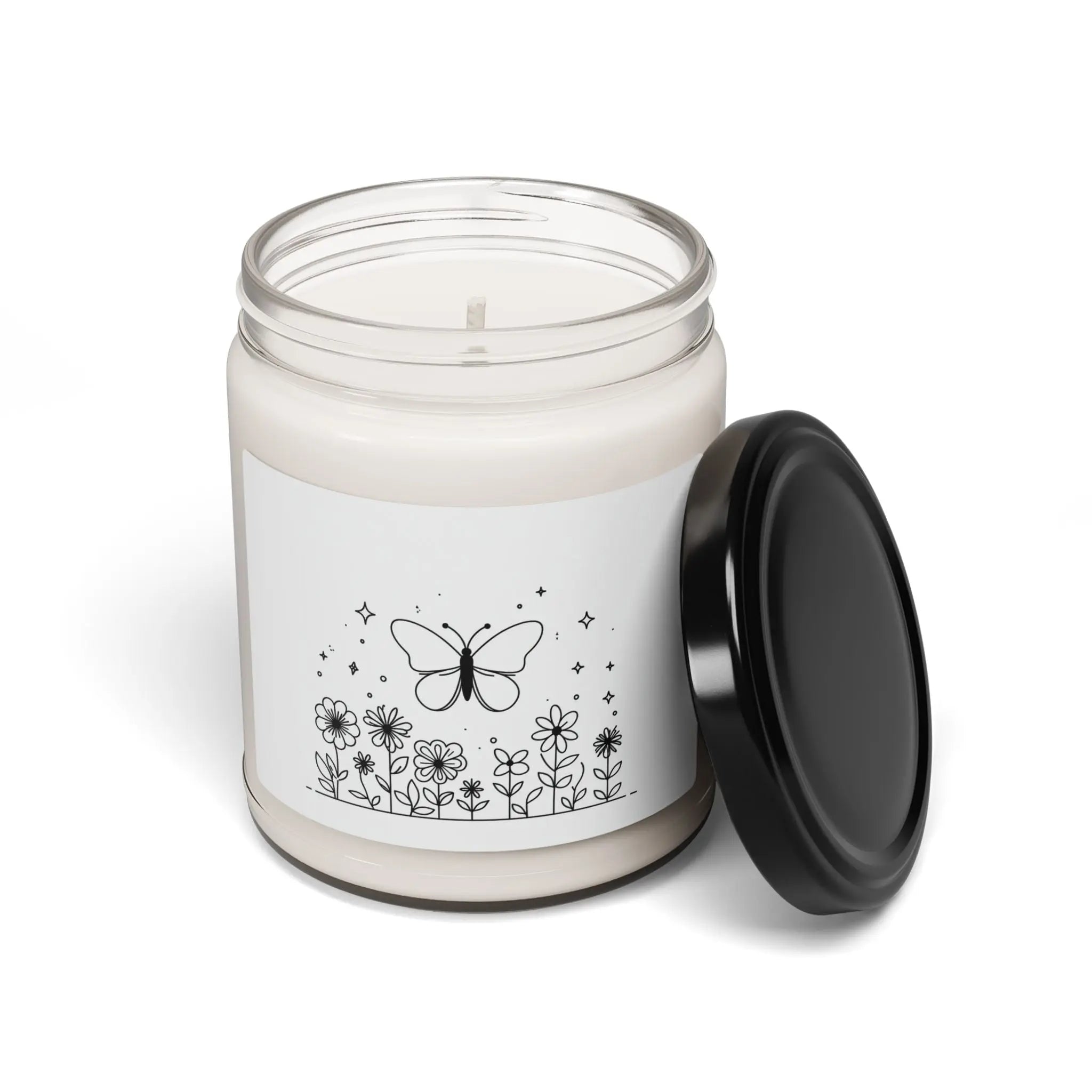 This scented candle is a black-and-white illustration features a whimsical butterfly hovering above a garden of blooming flowers. Printify